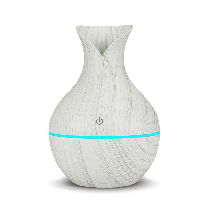 KBAYBO electric humidifier aroma oil diffuser in yellow wood design, emitting cool mist for a healthy atmosphere.