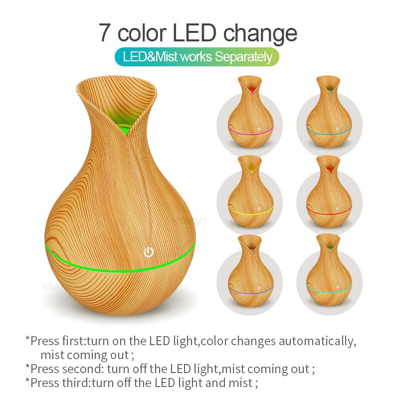 KBAYBO electric humidifier aroma oil diffuser in yellow wood design, emitting cool mist for a healthy atmosphere.