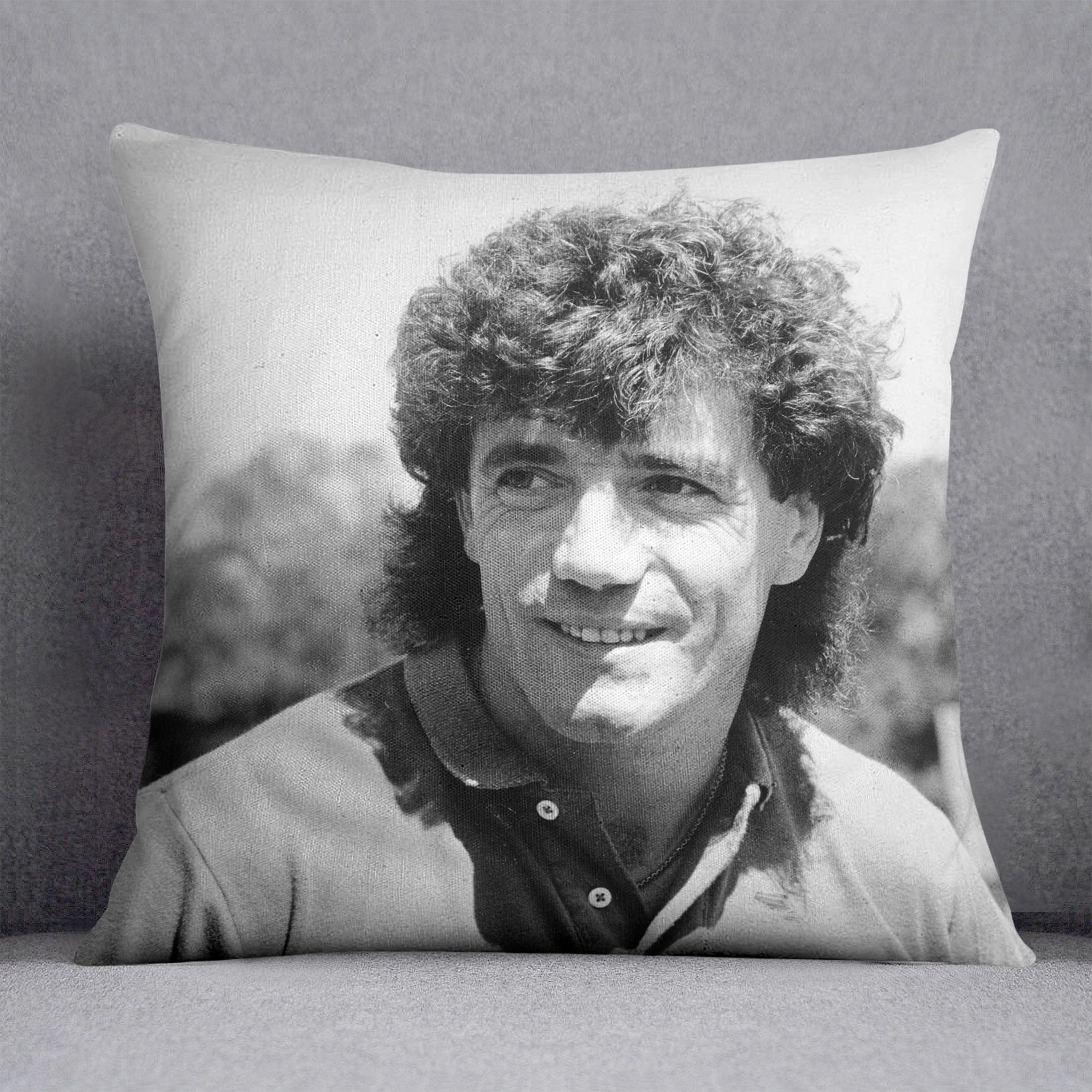 A vibrant Kevin Keegan Cushion featuring colorful abstract designs on luxurious vegan faux suede, perfect for home decor.