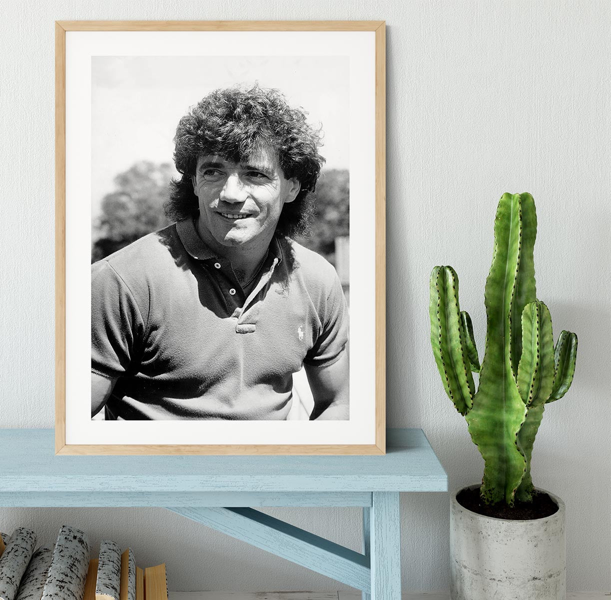 A beautifully framed print of Kevin Keegan, showcasing vibrant colors and high-quality craftsmanship in a stylish black frame.