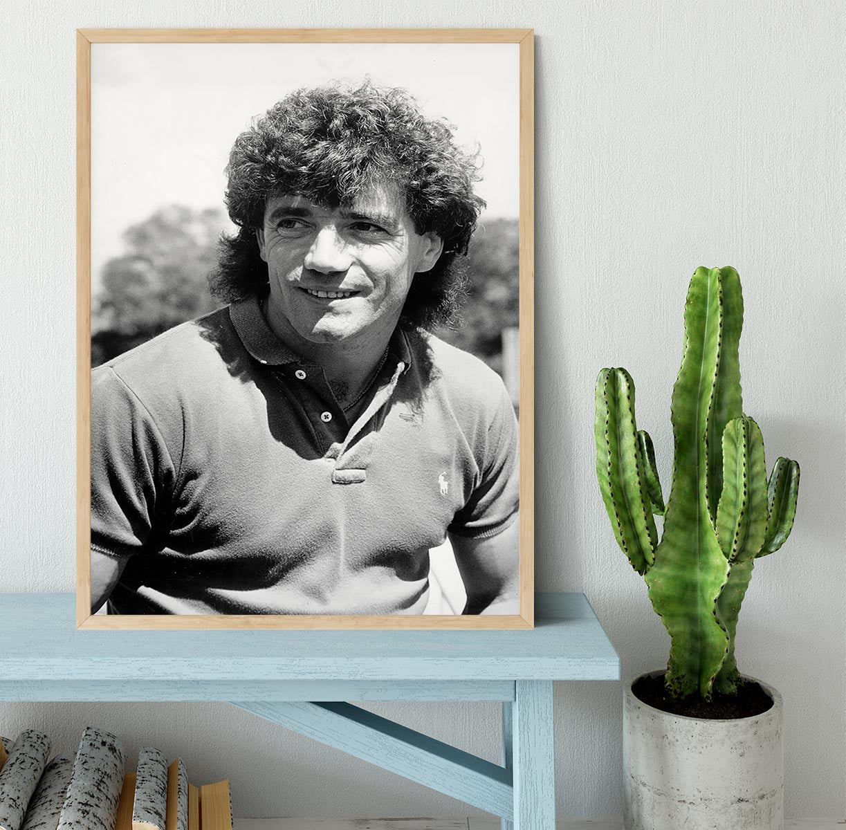 A beautifully framed print of Kevin Keegan, showcasing vibrant colors and high-quality craftsmanship in a stylish black frame.