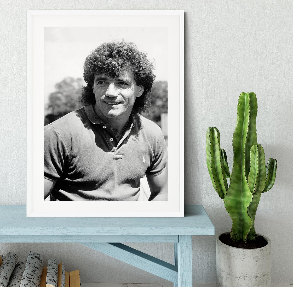 A beautifully framed print of Kevin Keegan, showcasing vibrant colors and high-quality craftsmanship in a stylish black frame.