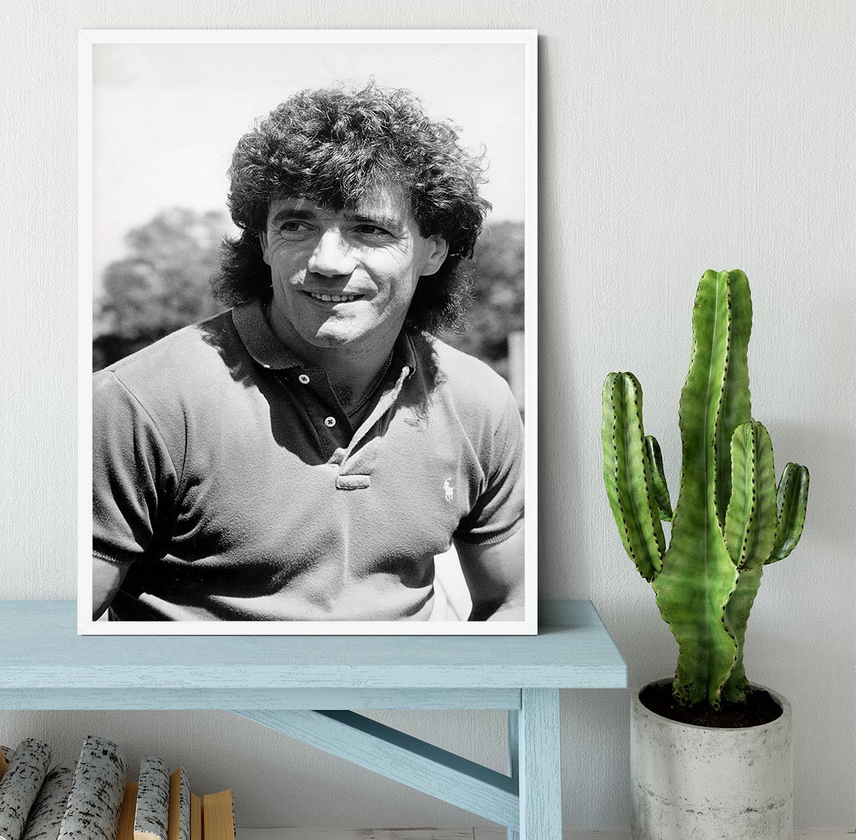 A beautifully framed print of Kevin Keegan, showcasing vibrant colors and high-quality craftsmanship in a stylish black frame.