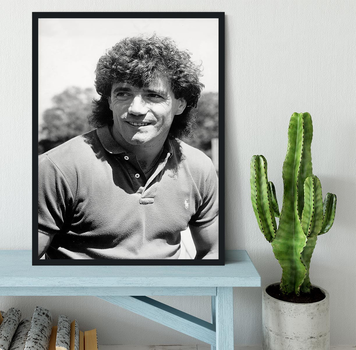 A beautifully framed print of Kevin Keegan, showcasing vibrant colors and high-quality craftsmanship in a stylish black frame.