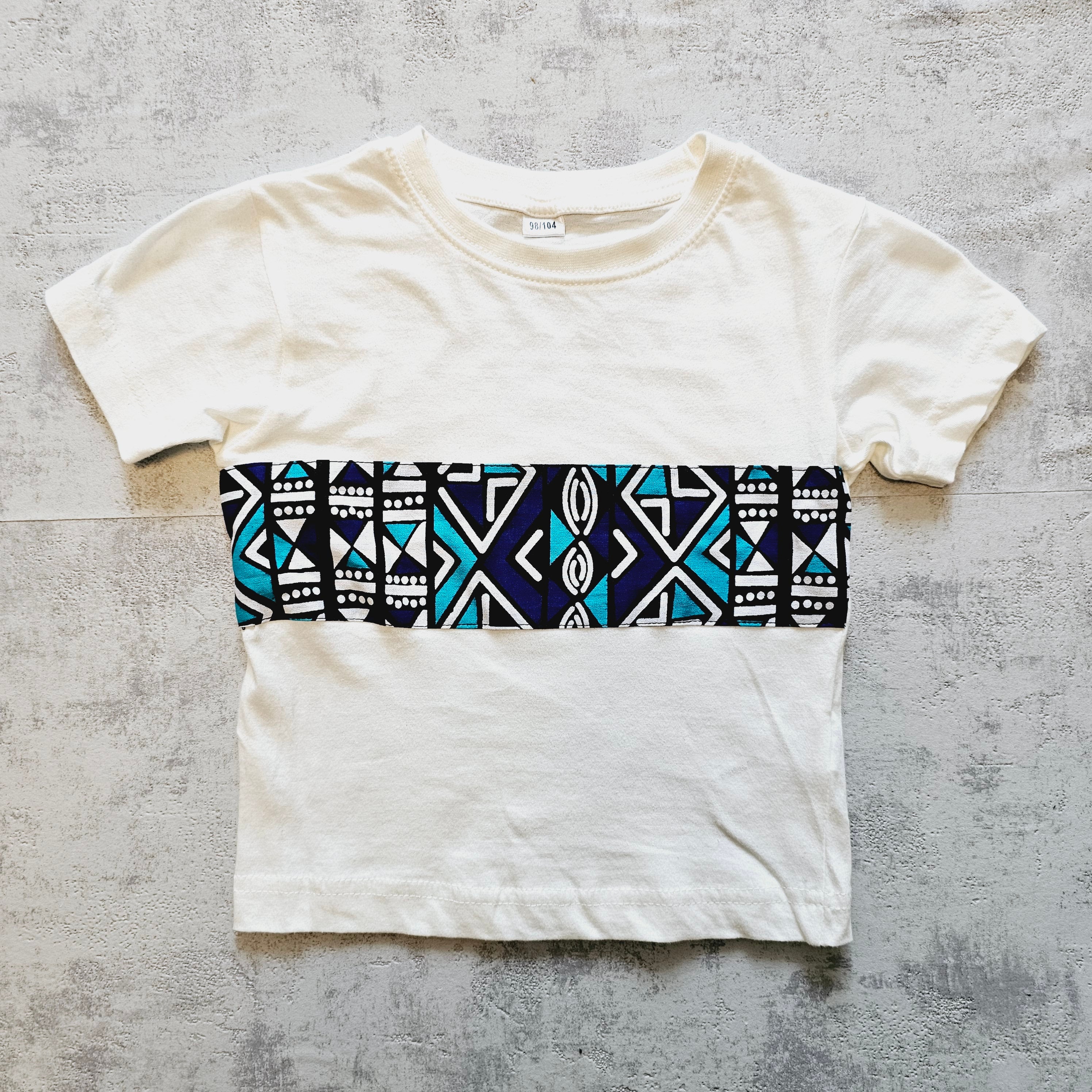 Kids T-shirt featuring vibrant African Ankara print detail on soft cotton fabric, perfect for stylish and comfortable wear.