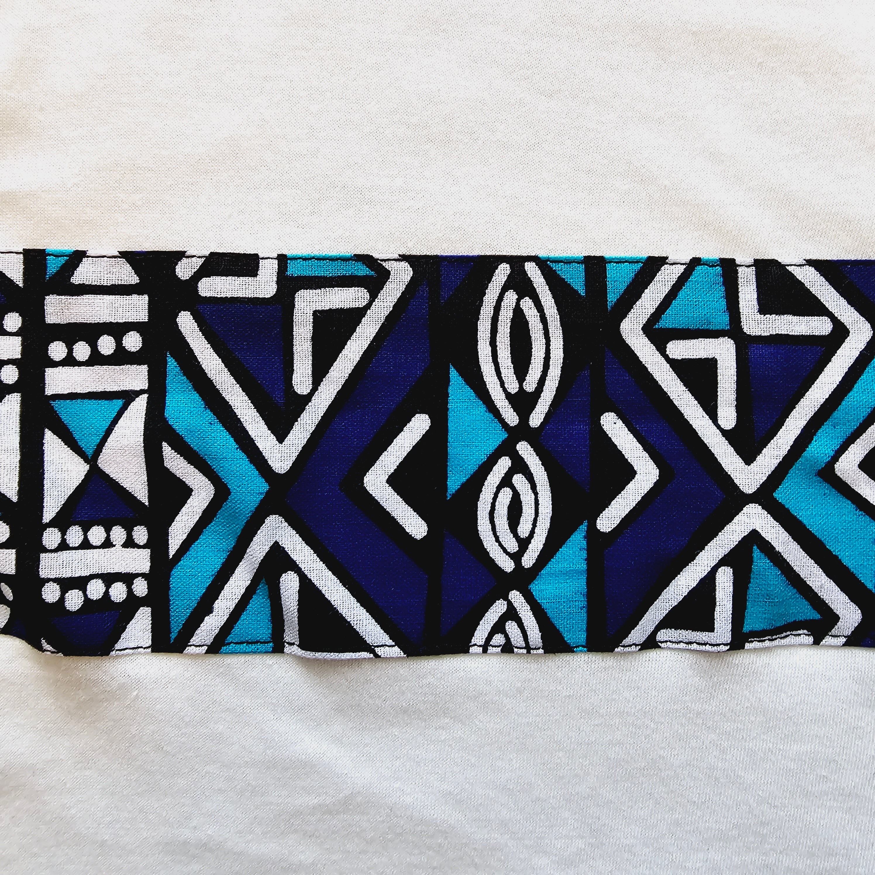 Kids T-shirt featuring vibrant African Ankara print detail on soft cotton fabric, perfect for stylish and comfortable wear.