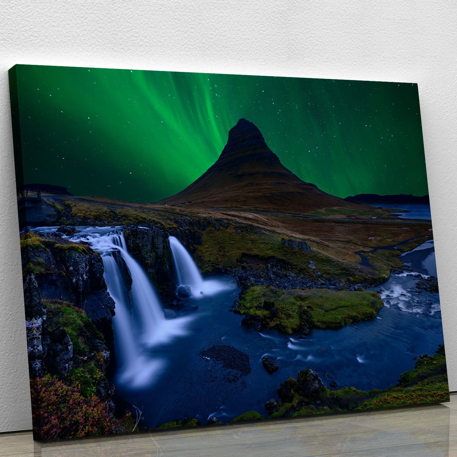 Kirkjufell mountain under a vibrant green sky, showcasing stunning natural beauty in a canvas print.