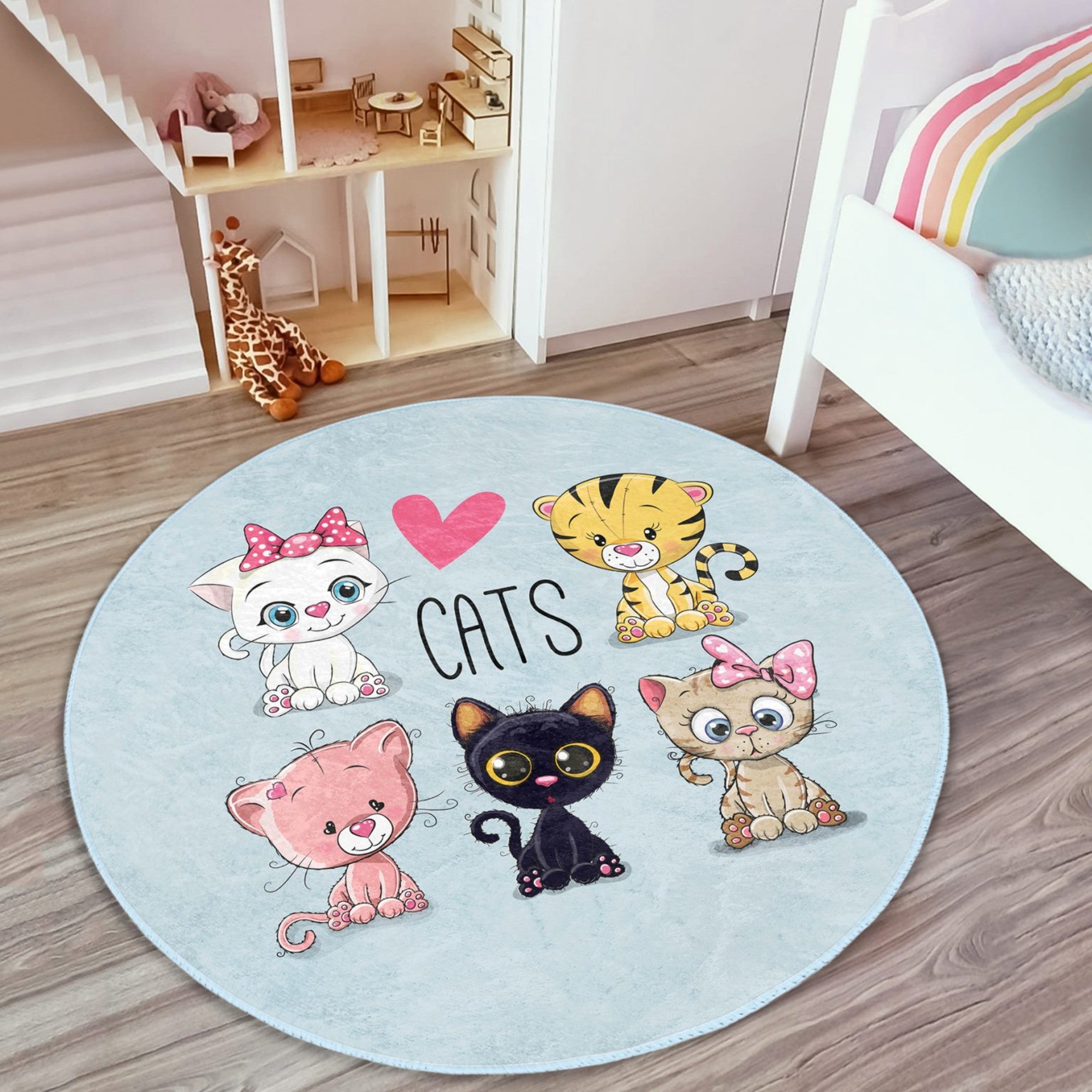 A round rug featuring a playful kitty pattern, designed for children's rooms, showcasing soft velvet fabric and vibrant colors.