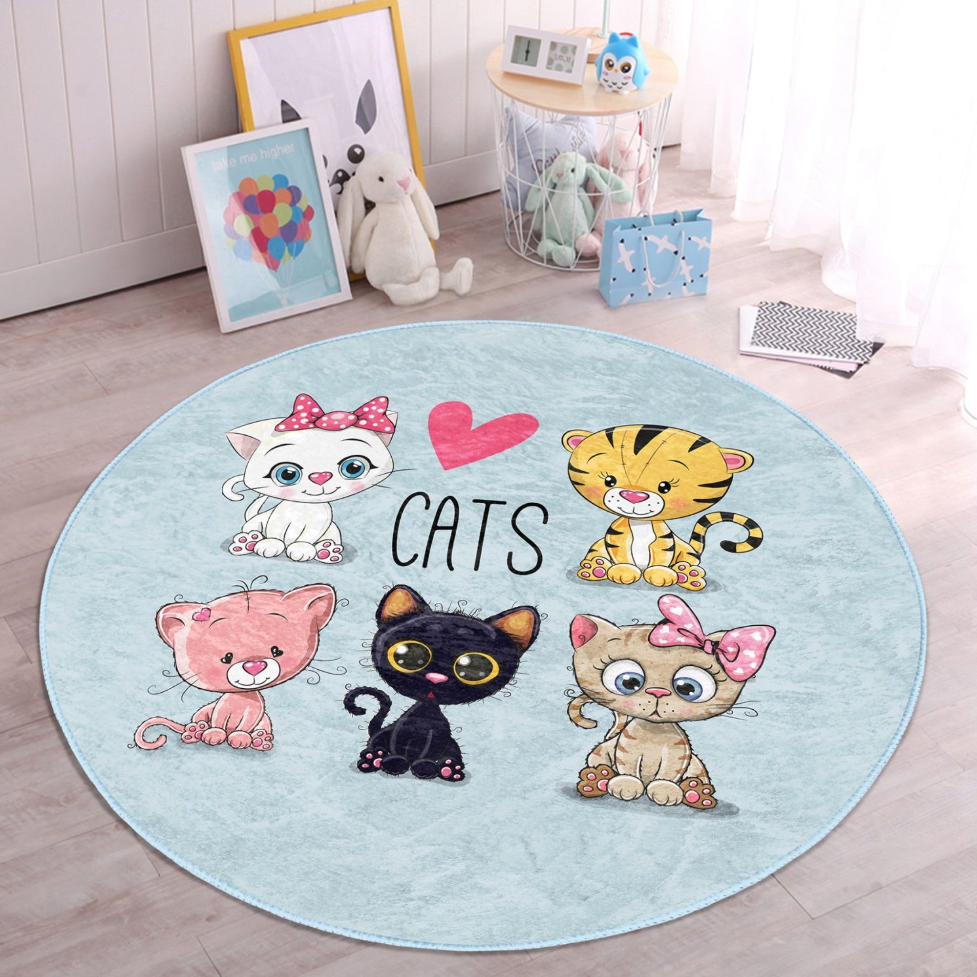 A round rug featuring a playful kitty pattern, designed for children's rooms, showcasing soft velvet fabric and vibrant colors.