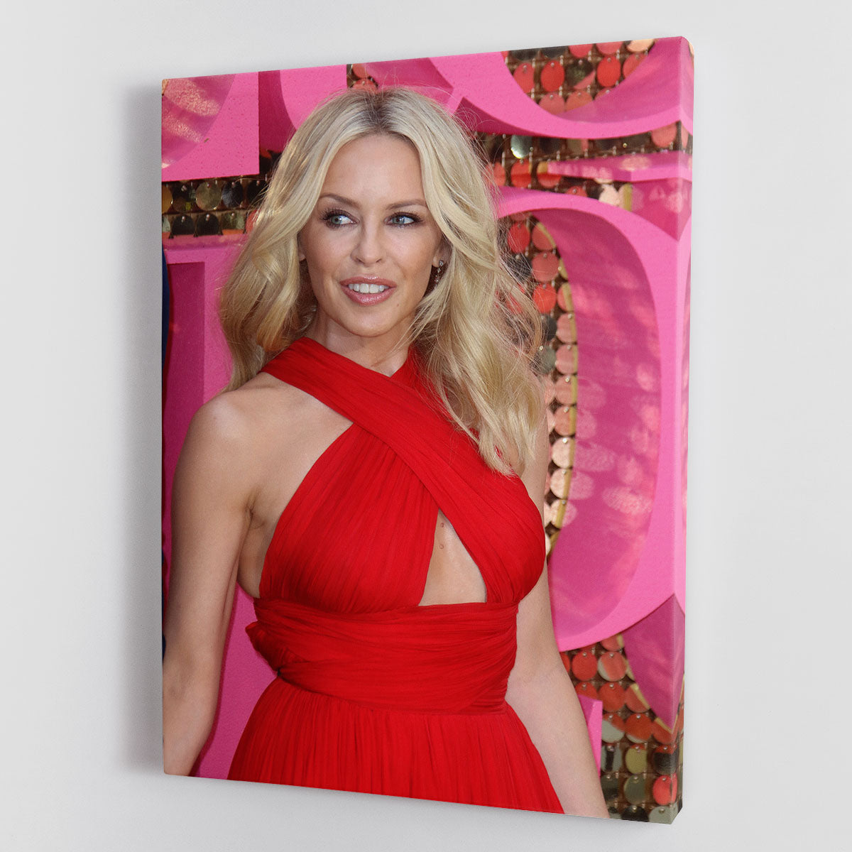A vibrant canvas print of Kylie Minogue in red, showcasing her iconic style and energy, perfect for home decor.