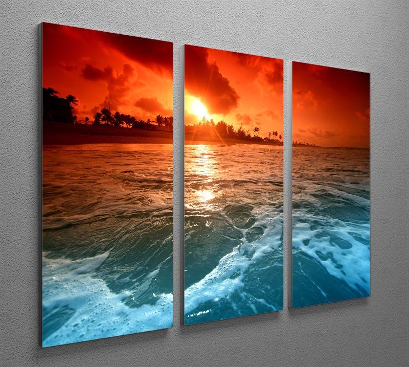 A stunning 3-panel canvas print depicting a vibrant ocean sunrise, perfect for home decor.