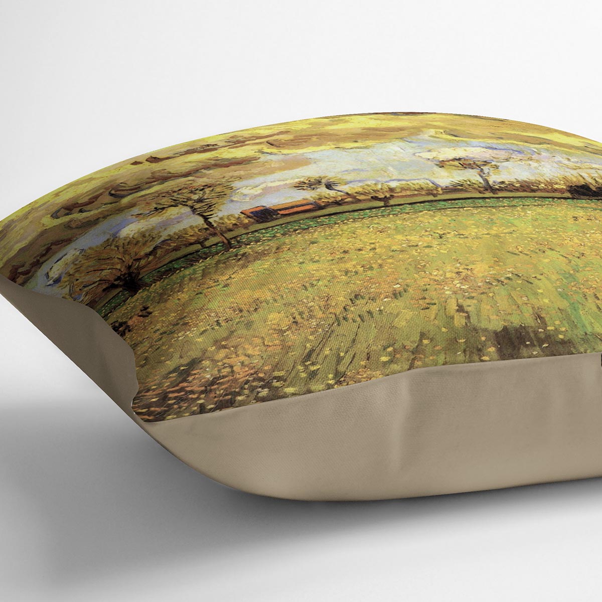 A vibrant cushion featuring Van Gogh's Landscape Under a Stormy Sky artwork, made from luxurious vegan faux suede.