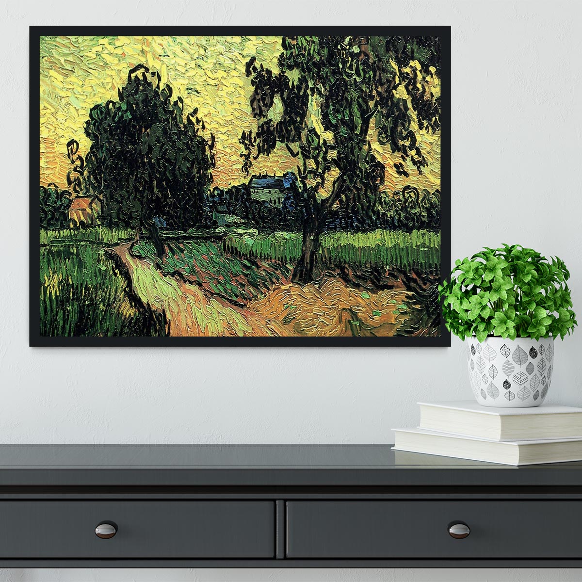 Framed artwork of Van Gogh's Landscape with the Chateau of Auvers at Sunset, showcasing vibrant colors and intricate details.