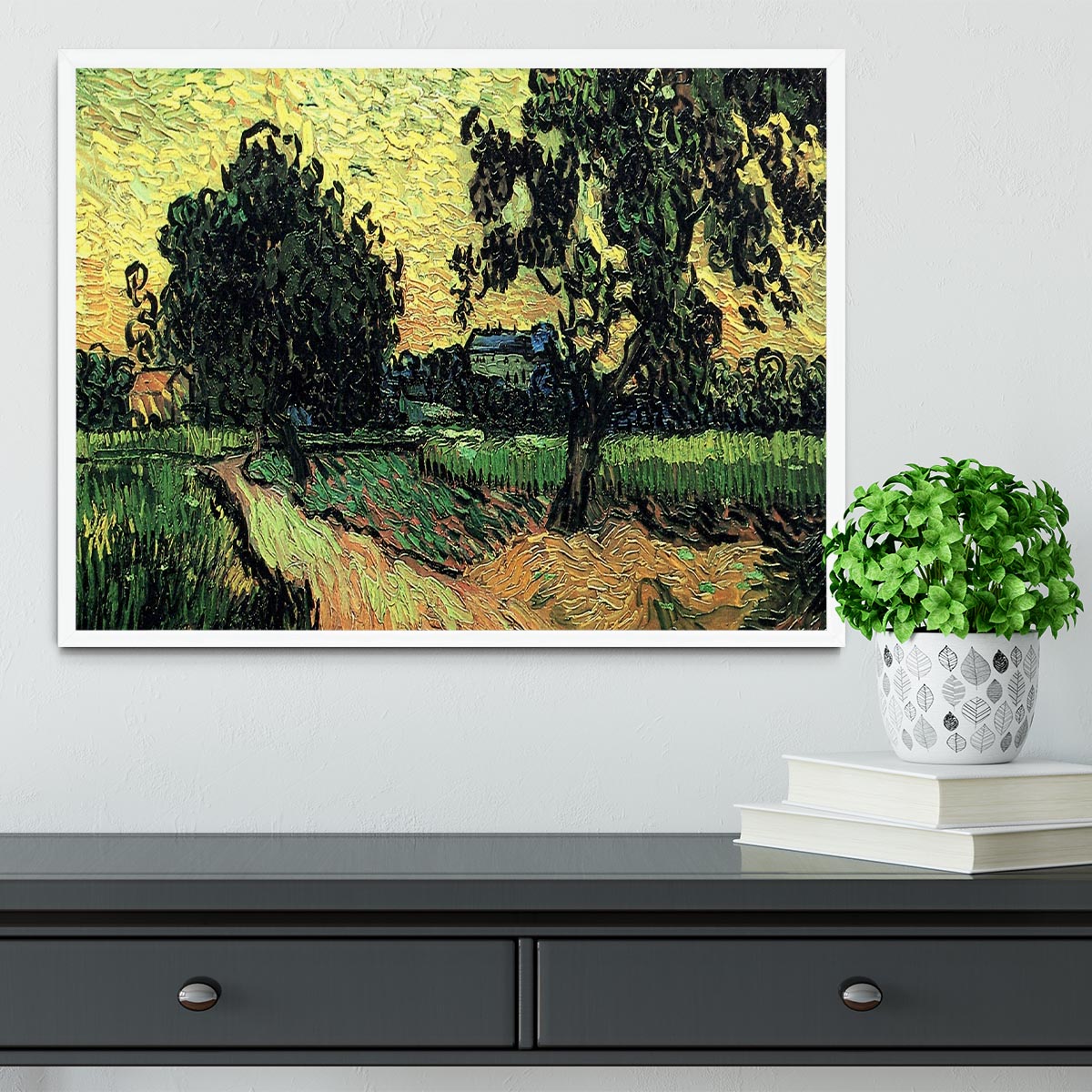 Framed artwork of Van Gogh's Landscape with the Chateau of Auvers at Sunset, showcasing vibrant colors and intricate details.