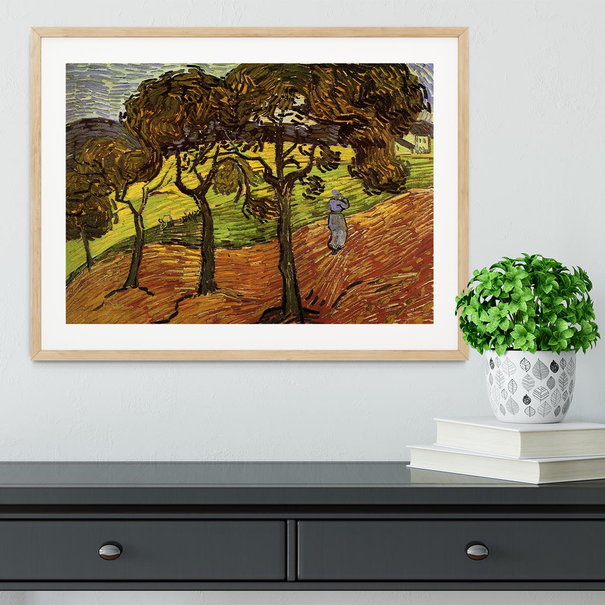 Framed print of Van Gogh's Landscape with Trees and Figures, showcasing vibrant colors and intricate details in a stylish frame.