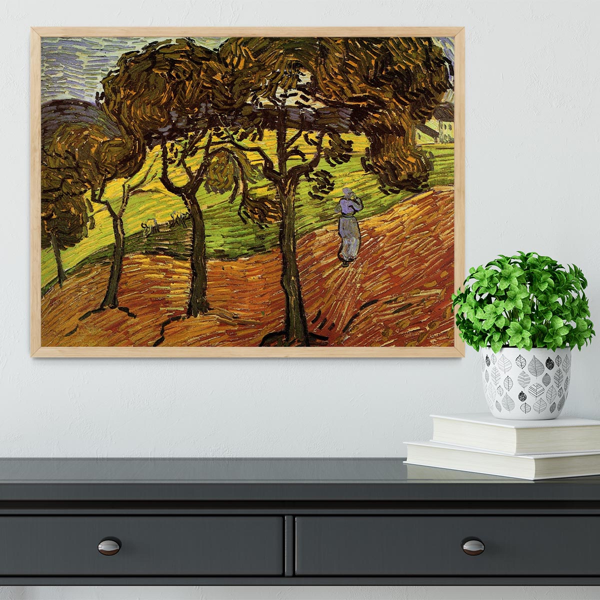 Framed print of Van Gogh's Landscape with Trees and Figures, showcasing vibrant colors and intricate details in a stylish frame.
