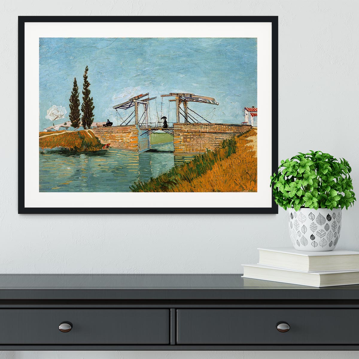 Framed print of Langlois Bridge by Van Gogh, showcasing vibrant colors and intricate details in a stylish frame.