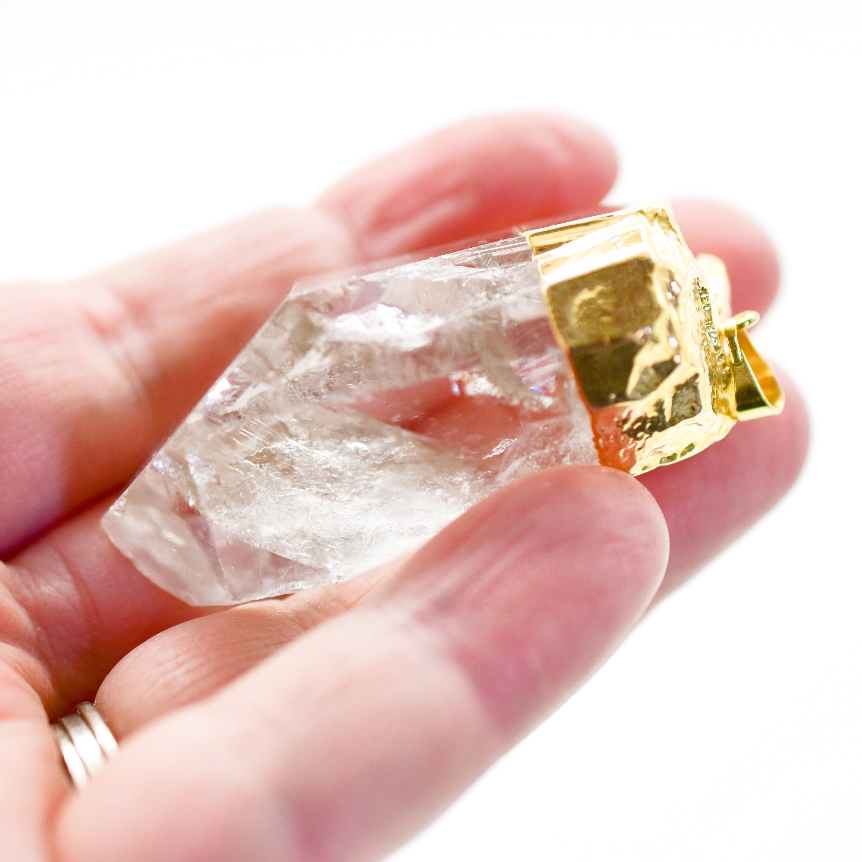 Large Single Crystal Point Pendant in gold or silver plating, showcasing a natural quartz crystal with a unique shape and shine.