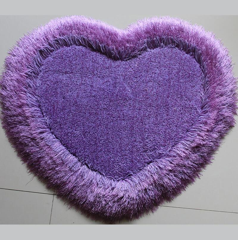 Lavender Heart Decorative Area Rug, soft shaggy texture, heart shape design, vibrant purple color, perfect for home decor.