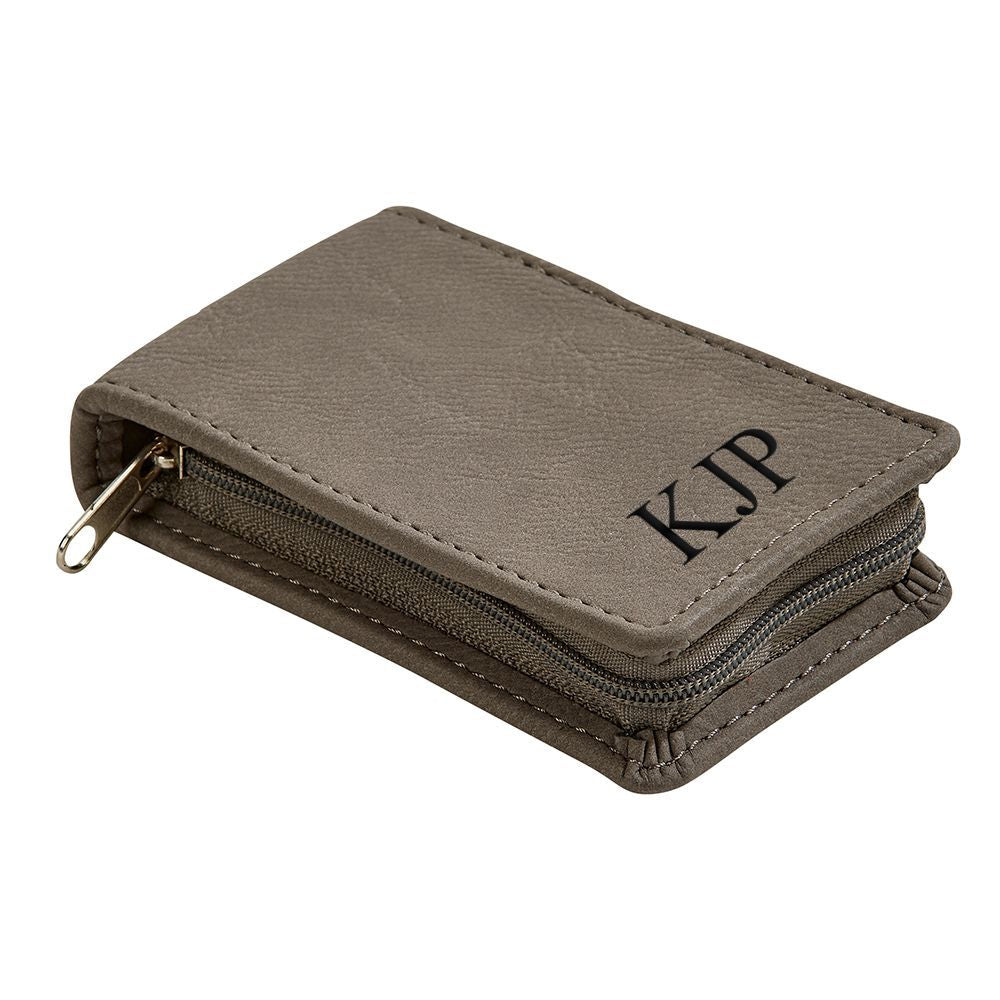Grey leatherette manicure set with stainless steel tools, including clippers, file, tweezers, and scissors, neatly organized in a zippered case.