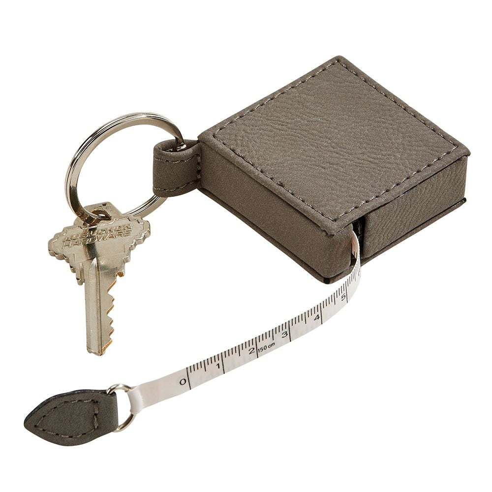Leatherette Square 5' Feet Tape Measure Grey Keychain, compact design with a stylish grey finish and dual measurement scales.