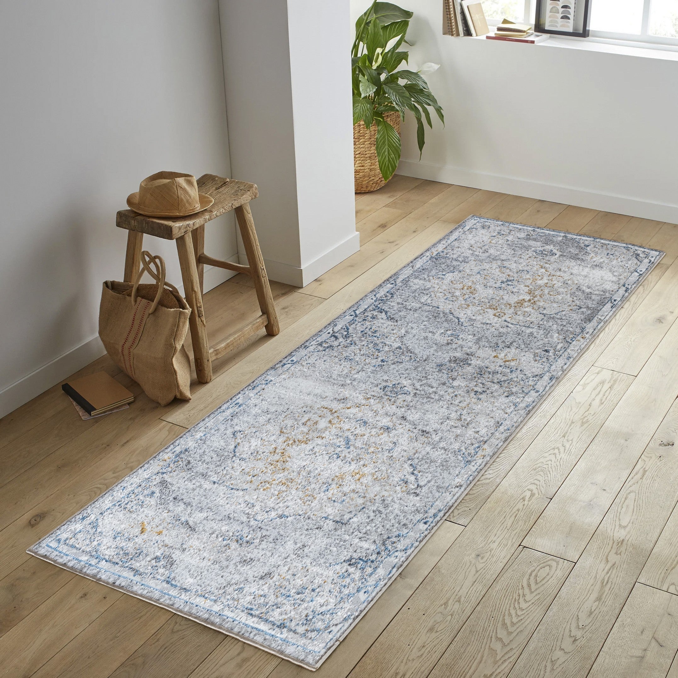 Legacy Multi Area Rug featuring a medallion pattern in white, made of durable polyester, perfect for high traffic areas.