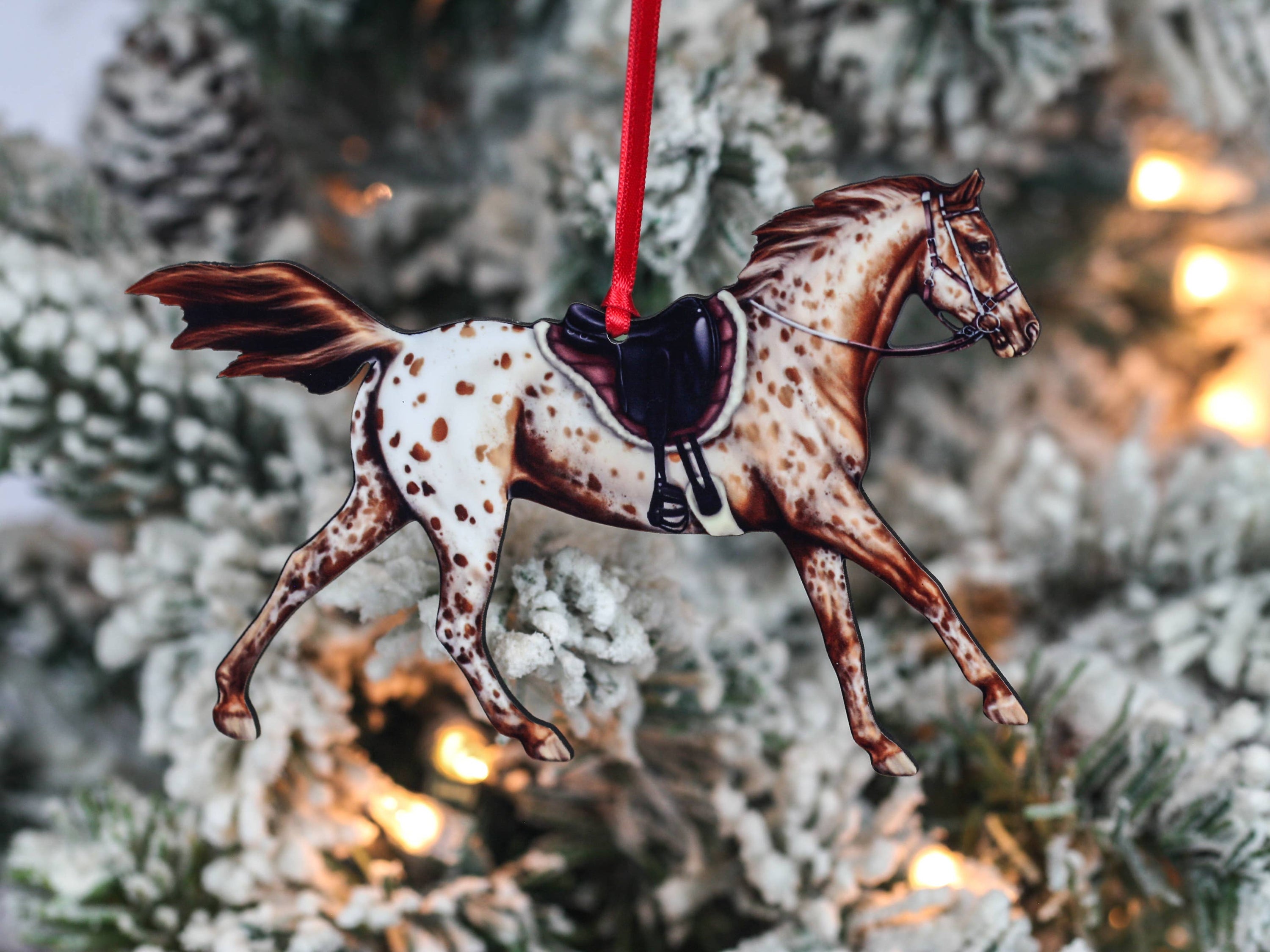 Leopard Appaloosa Endurance Horse Ornament in chestnut color, featuring red and black ribbons, handmade from composite wood.