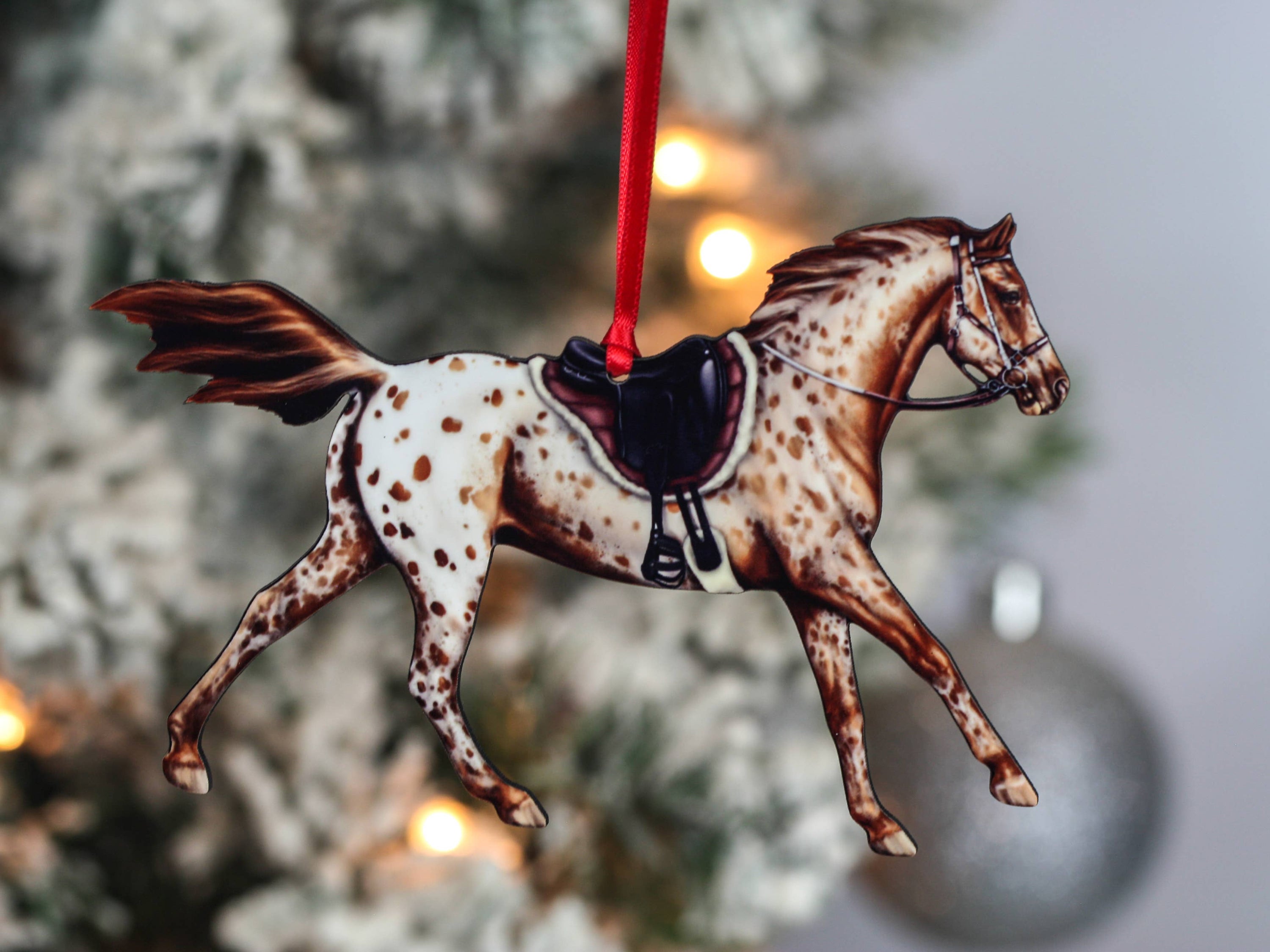Leopard Appaloosa Endurance Horse Ornament in chestnut color, featuring red and black ribbons, handmade from composite wood.