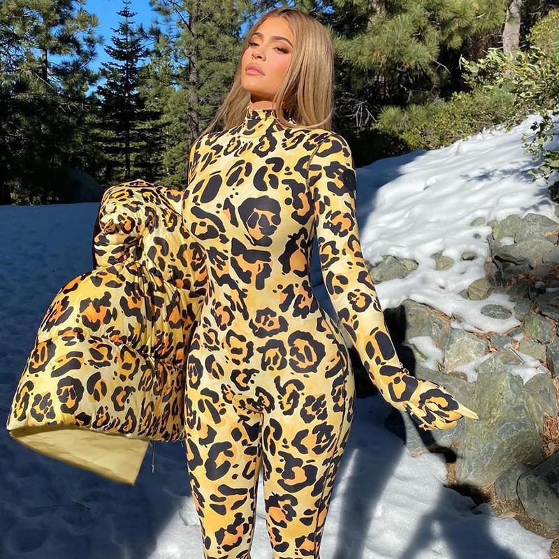 A stylish leopard print bodycon long sleeve romper for women, featuring matching gloves, perfect for parties and casual outings.