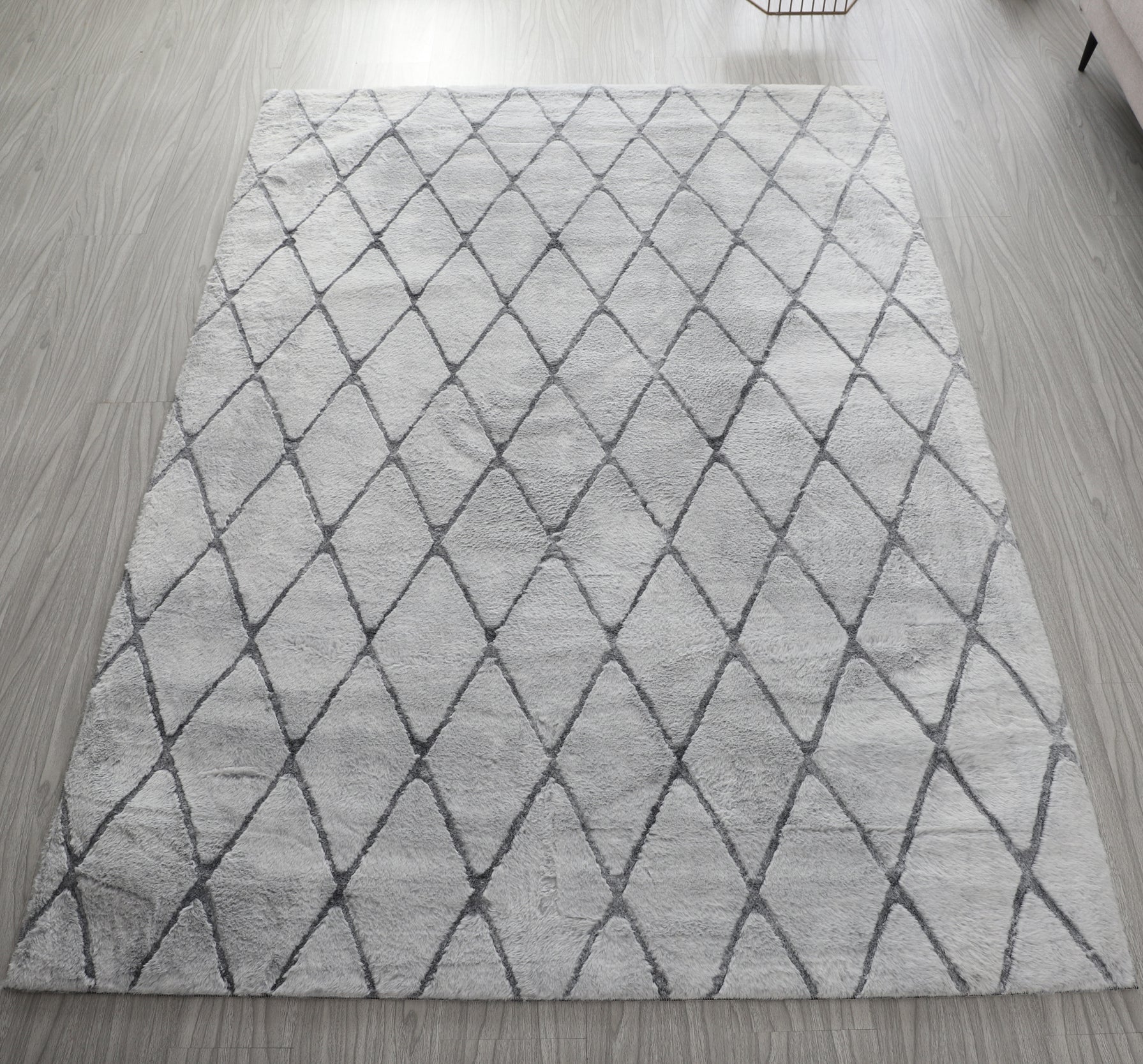 Lily Luxury Light Grey Chinchilla Faux Fur Area Rug showcasing its plush texture and elegant light grey color, perfect for contemporary decor.