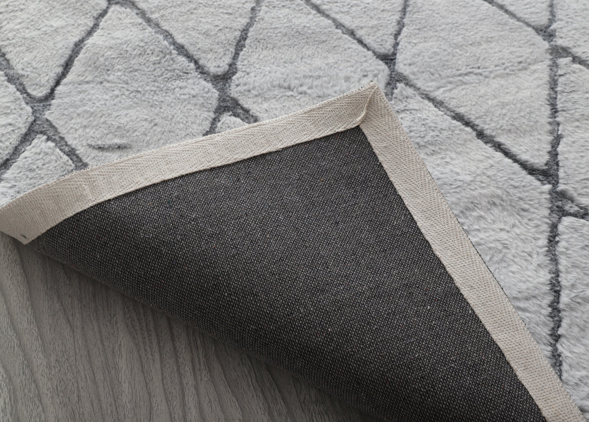 Lily Luxury Light Grey Chinchilla Faux Fur Area Rug showcasing its plush texture and elegant light grey color, perfect for contemporary decor.