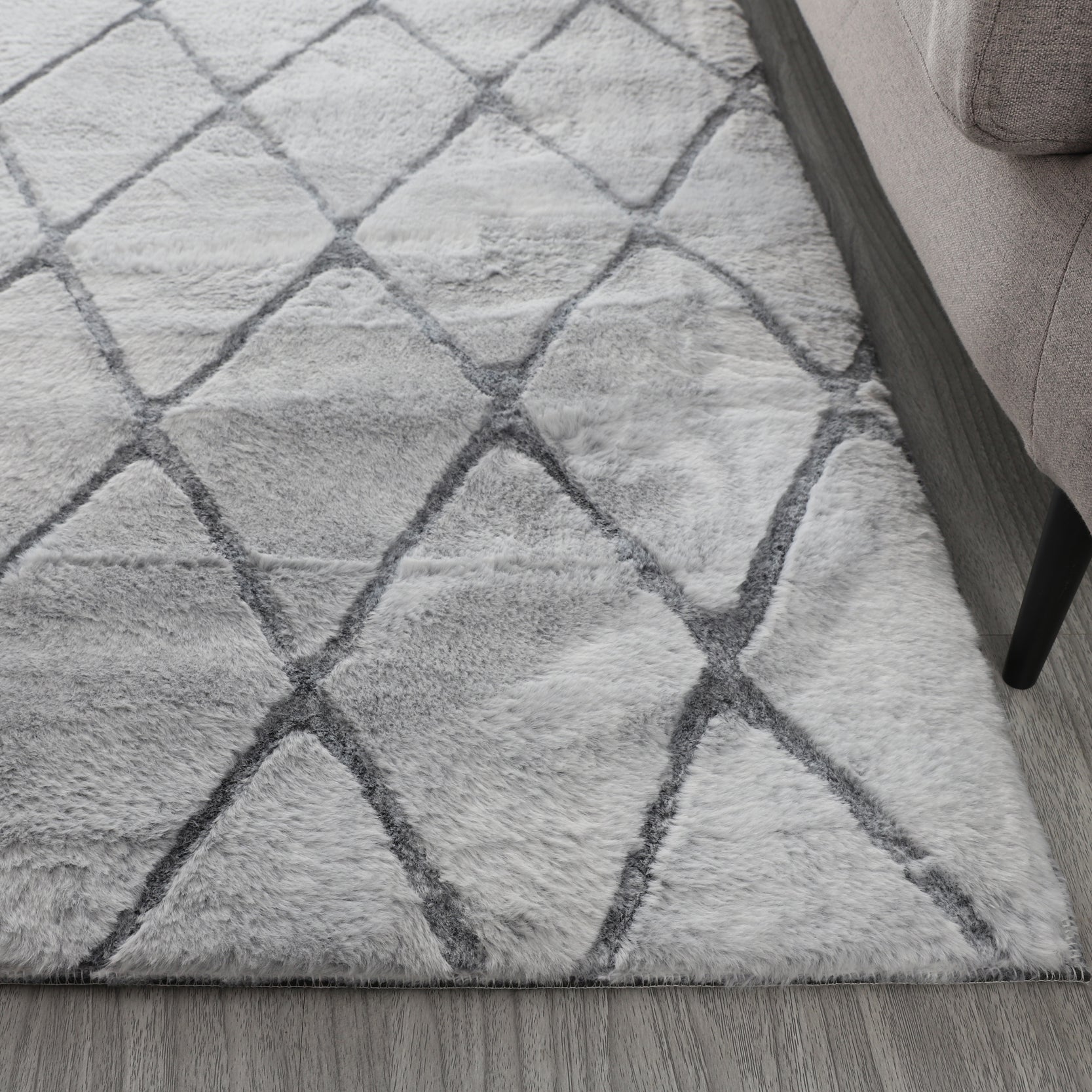 Lily Luxury Light Grey Chinchilla Faux Fur Area Rug showcasing its plush texture and elegant light grey color, perfect for contemporary decor.