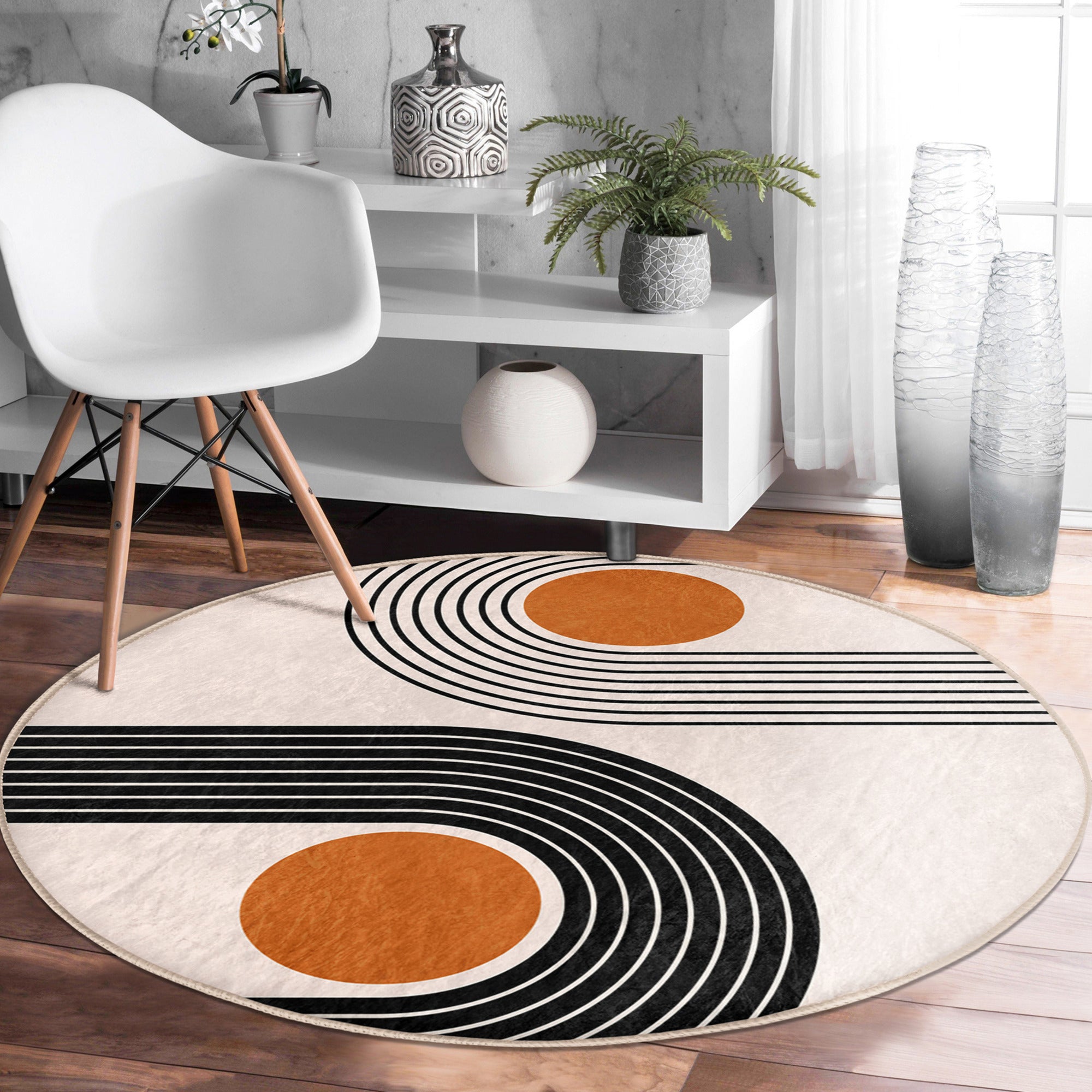 A stylish round rug featuring an abstract circle design, made from soft velvet fabric, suitable for living rooms and bedrooms.