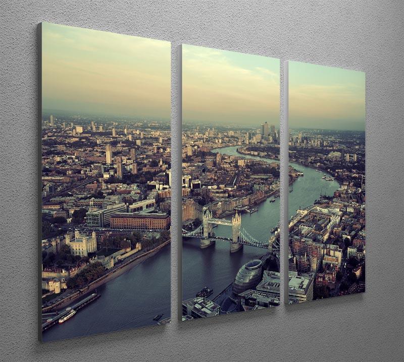A stunning panoramic view of London's skyline at sunset, displayed on a 3-panel canvas print, showcasing vibrant colors and intricate details.