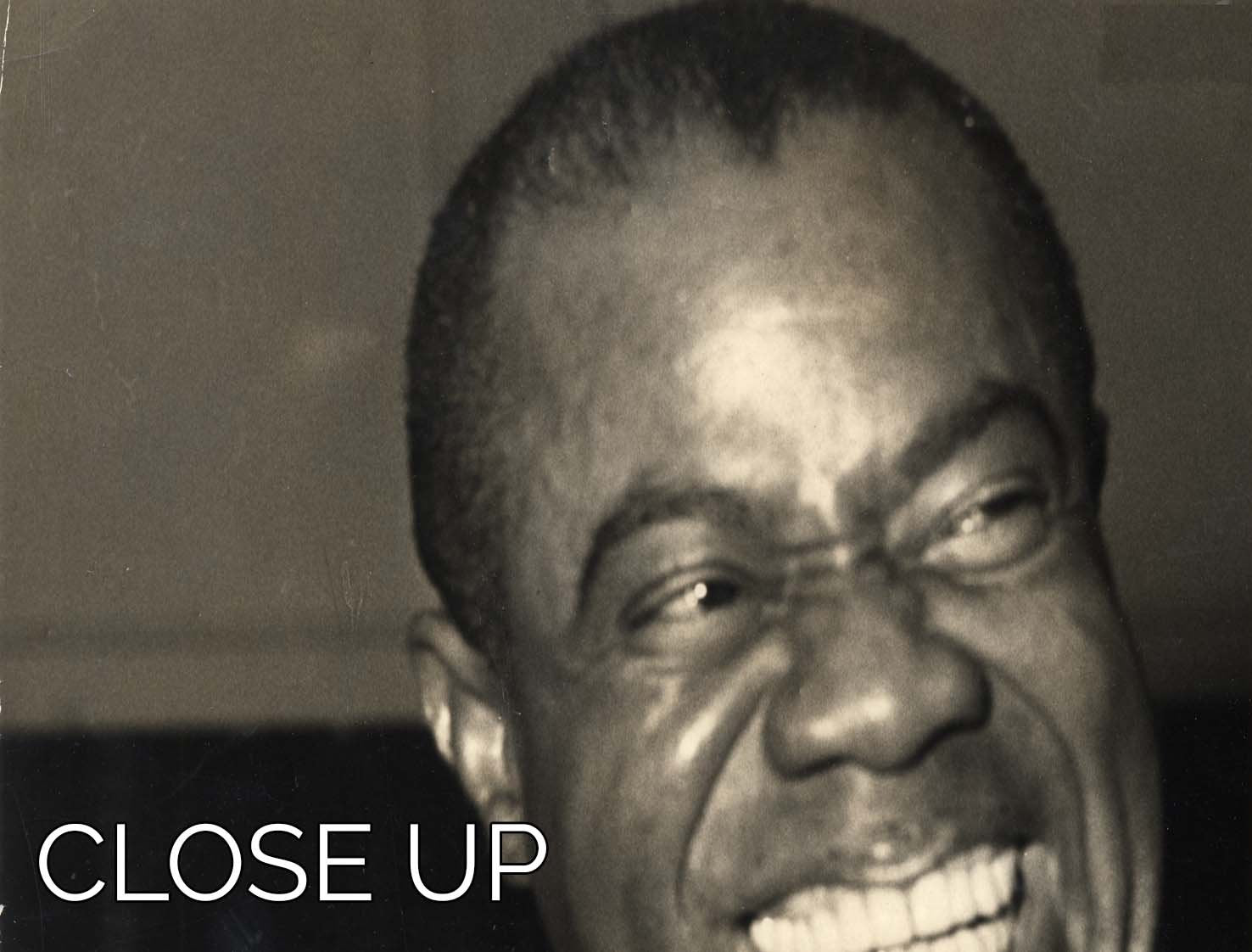 Three-panel canvas print featuring Louis Armstrong laughing, showcasing vibrant colors and joyful expression.