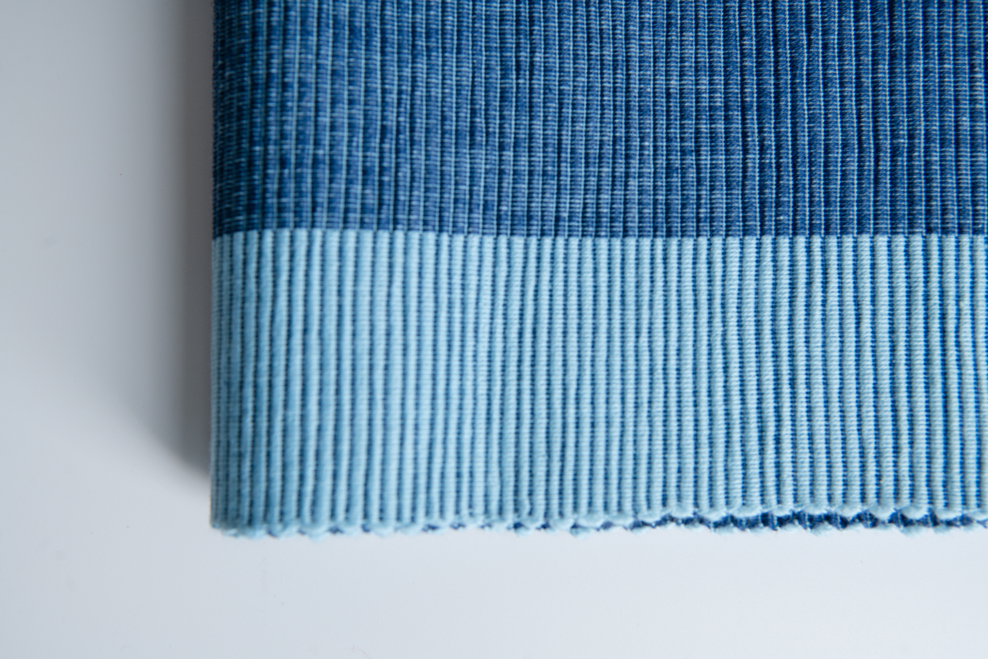 Luxury blue table runner made from 100% organic cotton, showcasing a premium weave and handmade craftsmanship.