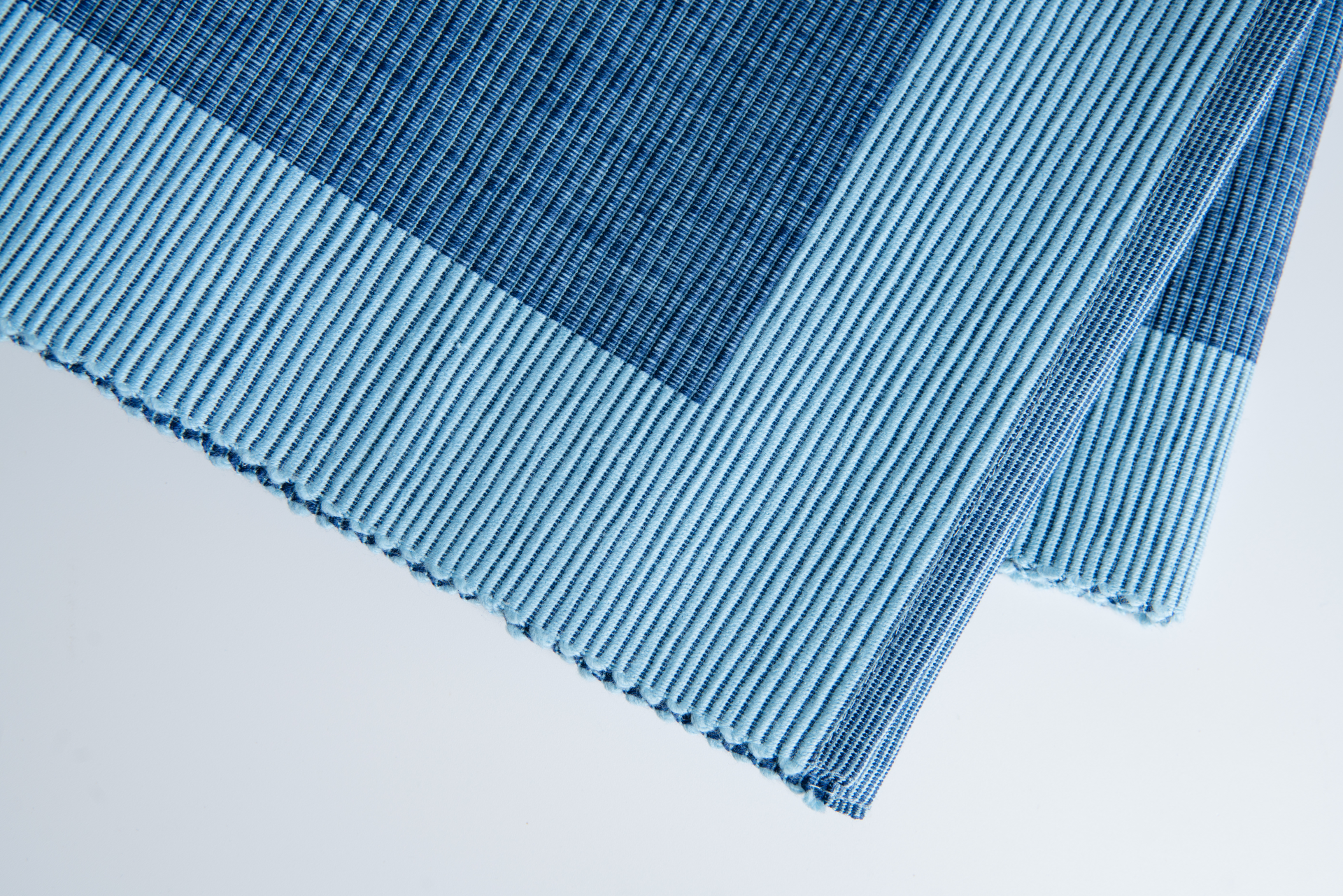 Luxury blue table runner made from 100% organic cotton, showcasing a premium weave and handmade craftsmanship.