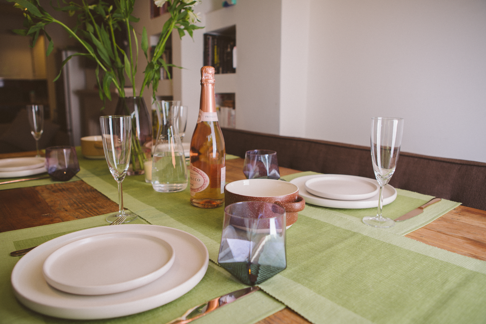 Luxury green table runner made from 100% organic cotton, showcasing a premium quality weave and handmade craftsmanship, perfect for elegant dining settings.