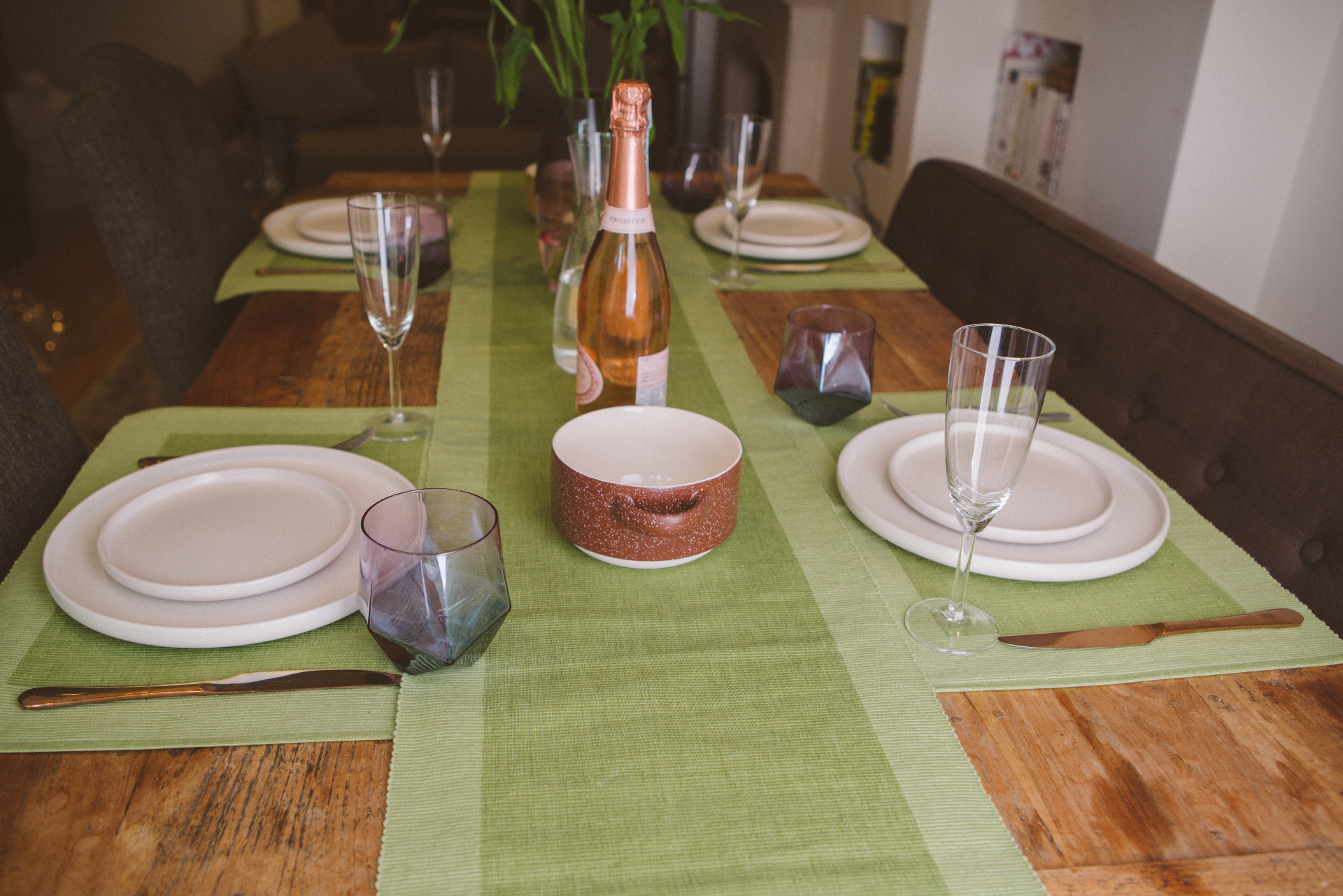 Luxury green table runner made from 100% organic cotton, showcasing a premium quality weave and handmade craftsmanship, perfect for elegant dining settings.