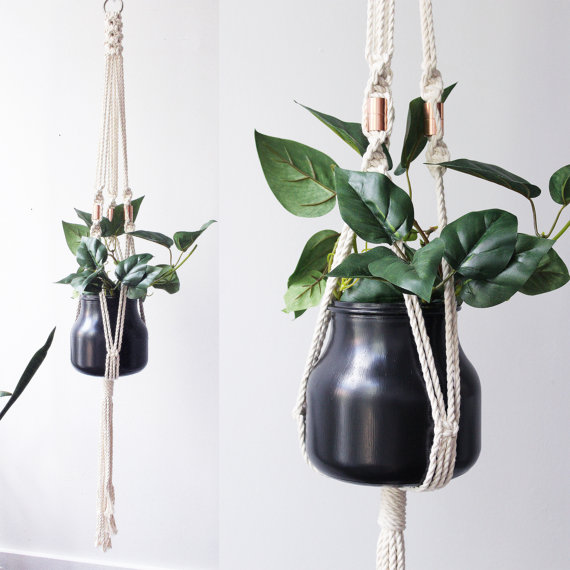 Handcrafted macrame plant hanger made from 100% cotton rope, featuring a stylish design suitable for various pot sizes up to 8 inches in diameter.