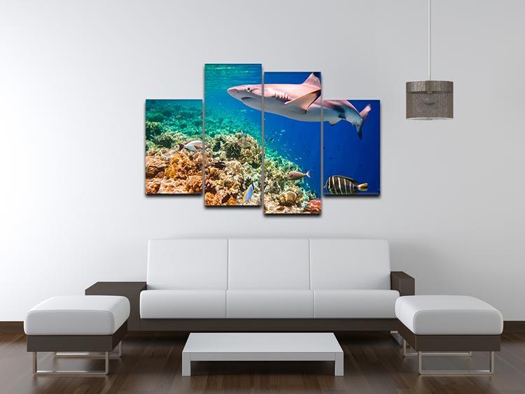 A vibrant 4 split panel canvas artwork depicting a coral reef in the Maldives Indian Ocean, showcasing colorful marine life and underwater scenery.