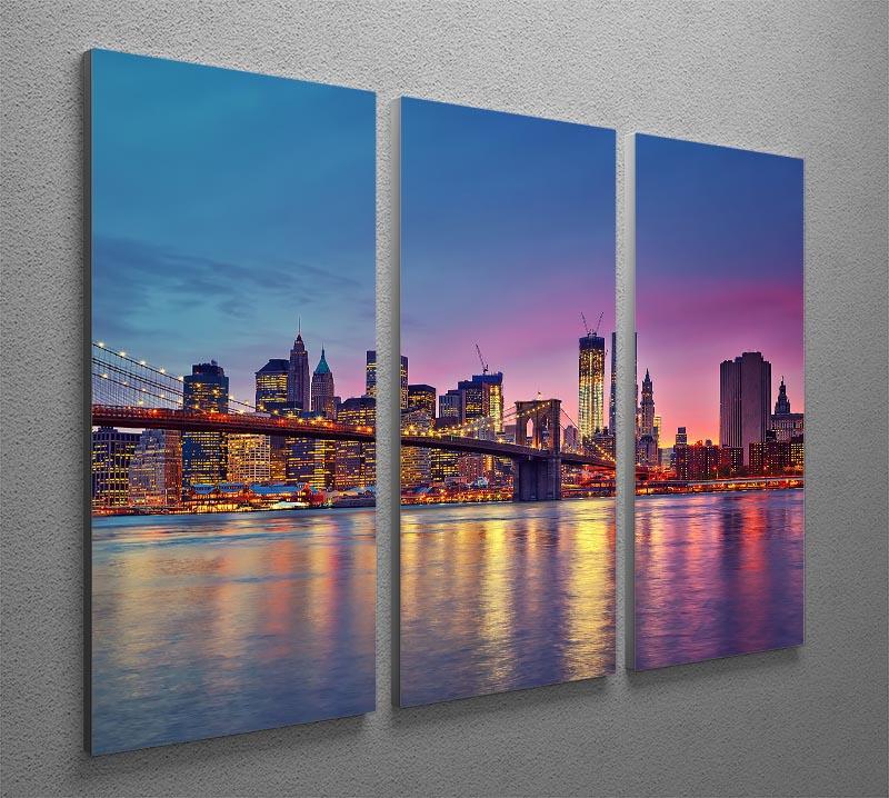 A stunning 3-panel canvas print depicting the Manhattan skyline at dusk, showcasing vibrant colors and intricate details.