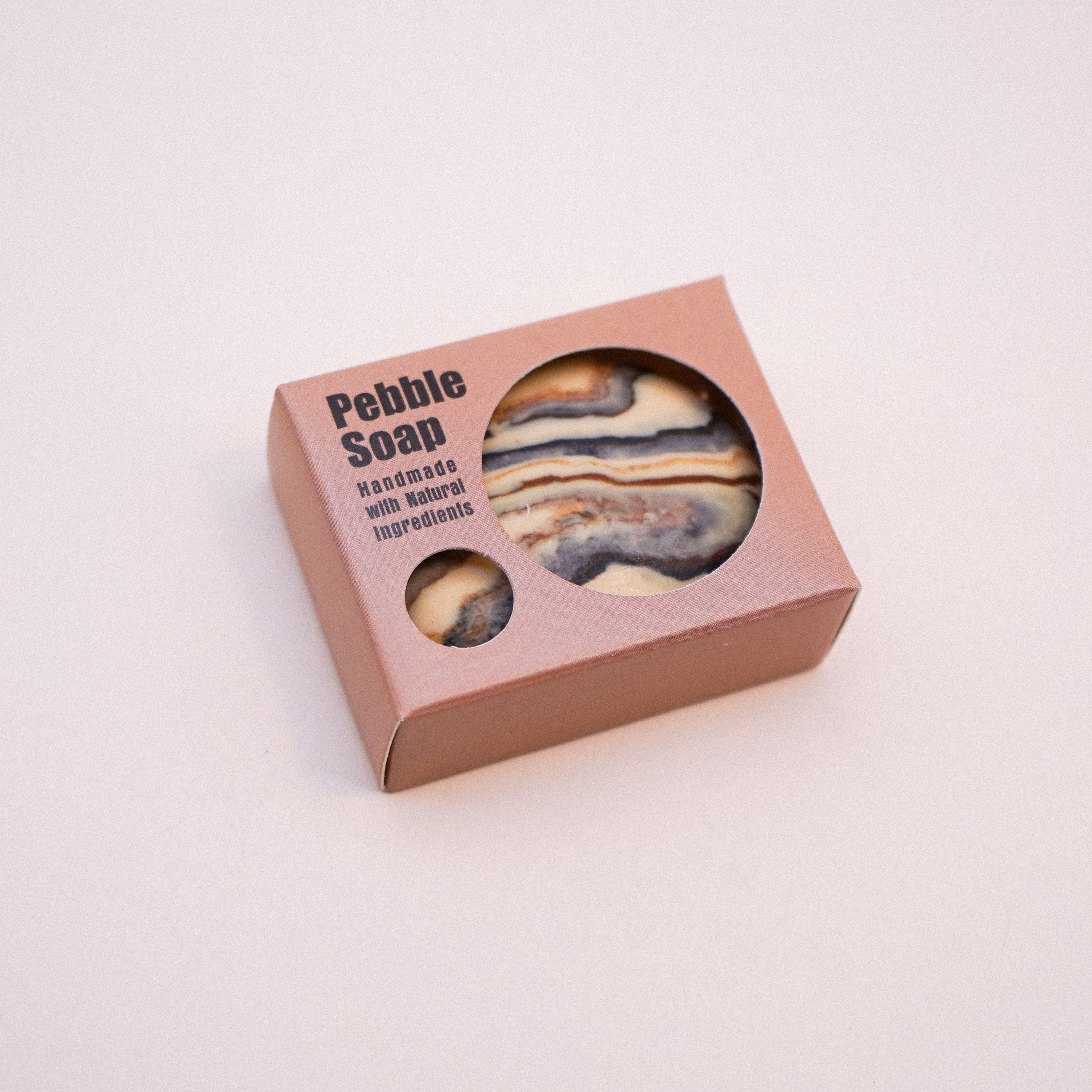 A collection of unique Marble Effect Pebble Soaps in various colors and designs, showcasing their natural and handmade quality.