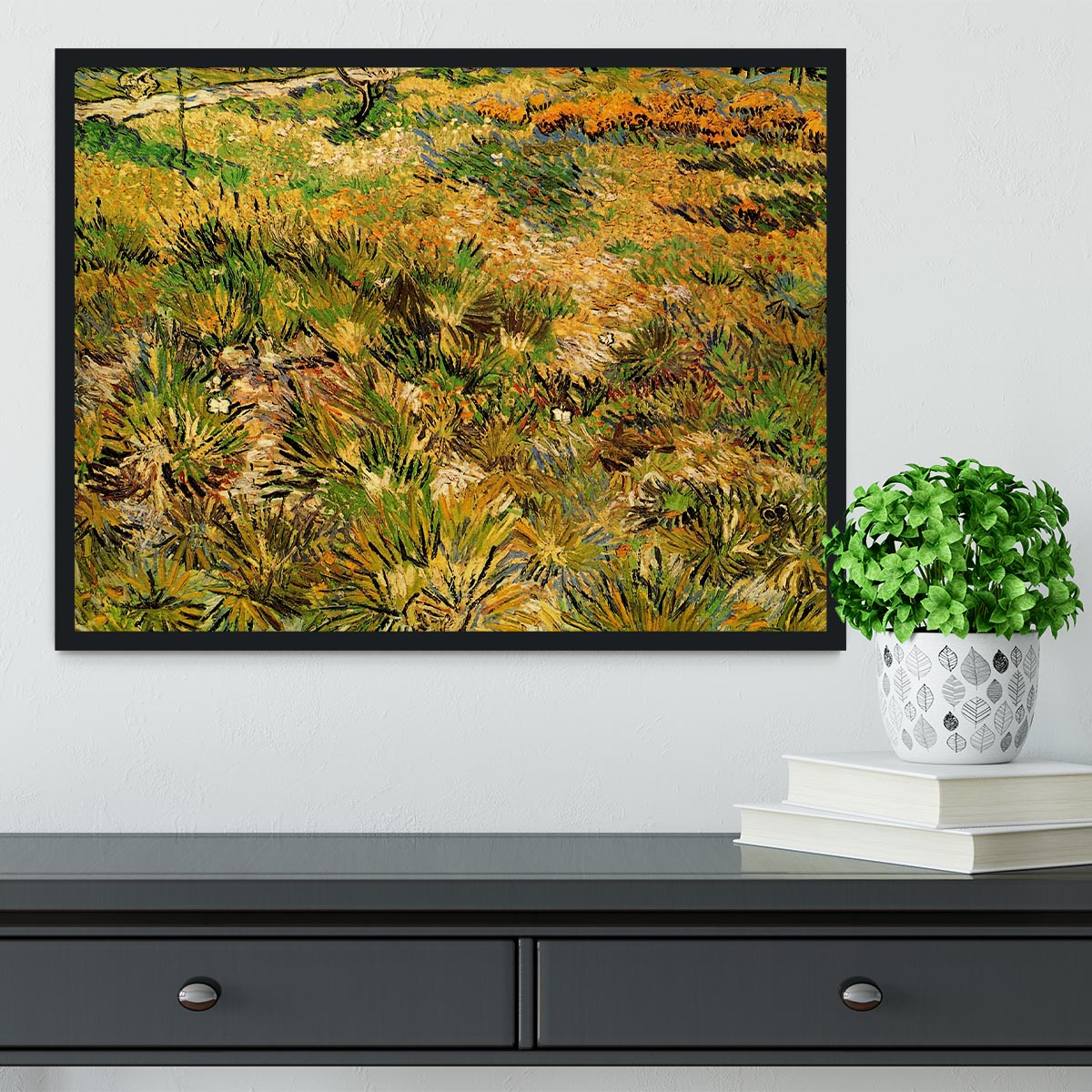 Framed print of Van Gogh's Meadow in the Garden of Saint-Paul Hospital, showcasing vibrant colors and intricate details.