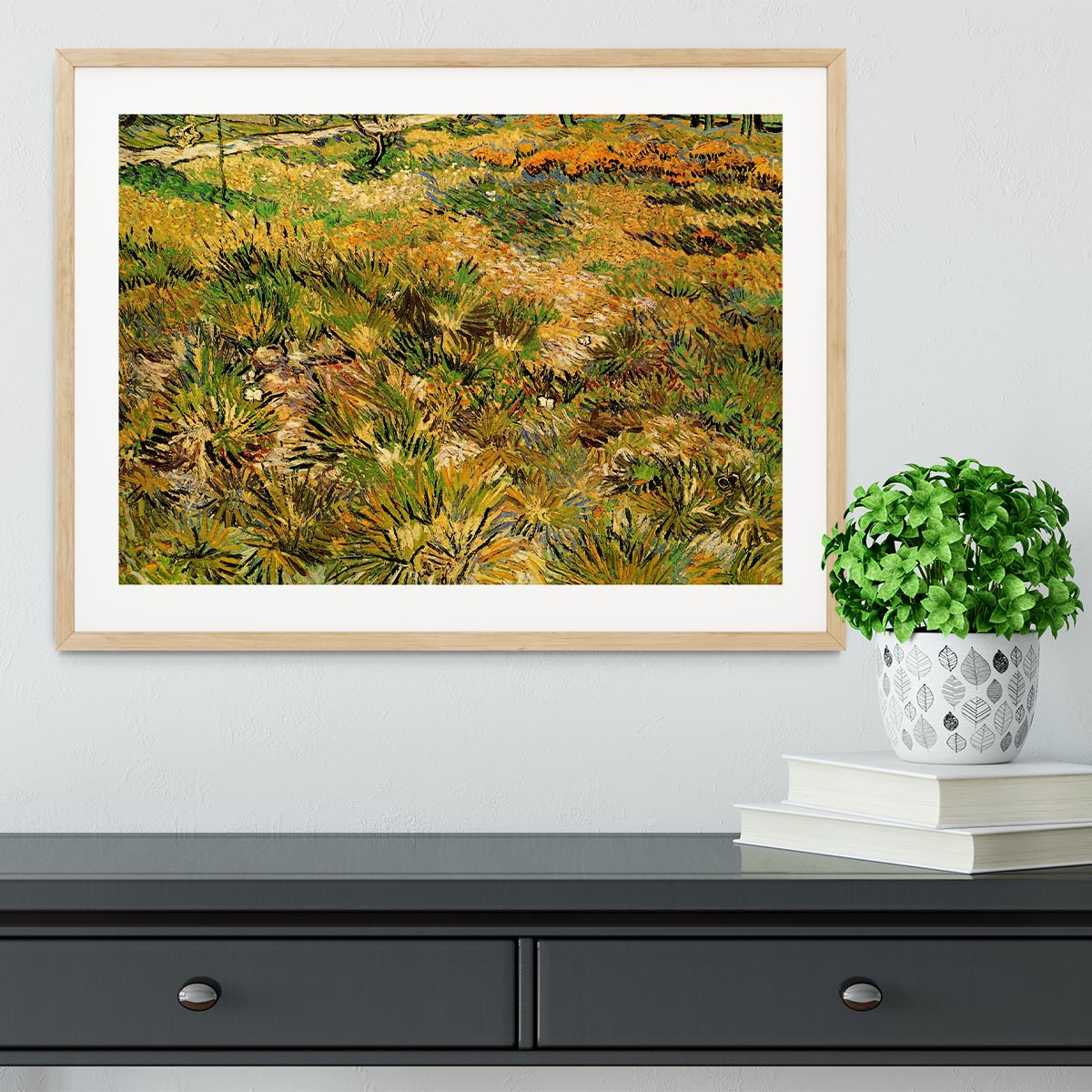 Framed print of Van Gogh's Meadow in the Garden of Saint-Paul Hospital, showcasing vibrant colors and intricate details.