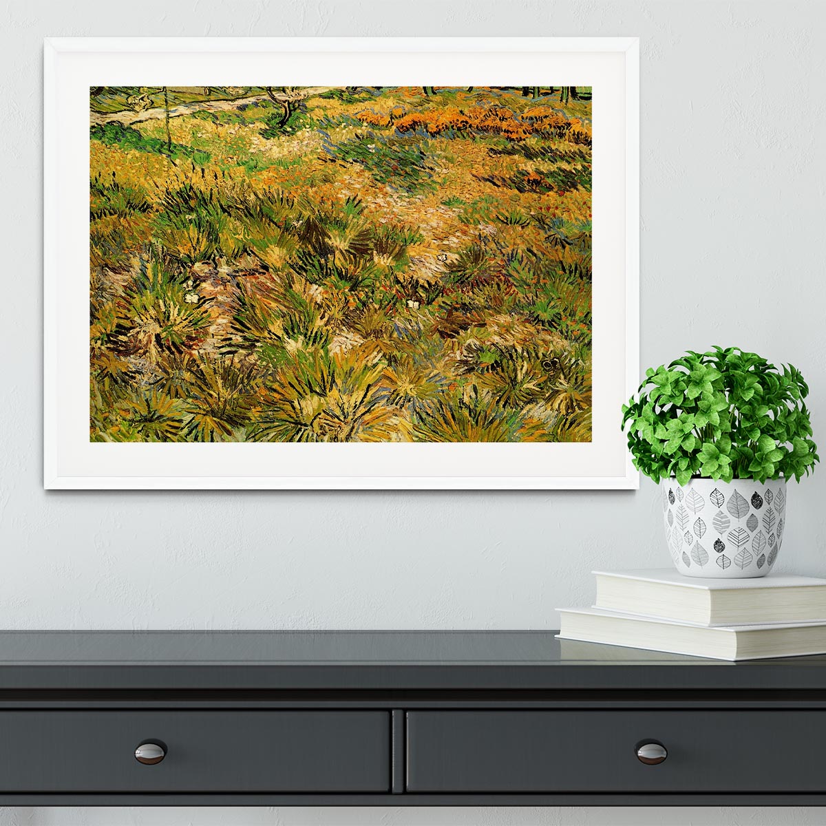 Framed print of Van Gogh's Meadow in the Garden of Saint-Paul Hospital, showcasing vibrant colors and intricate details.