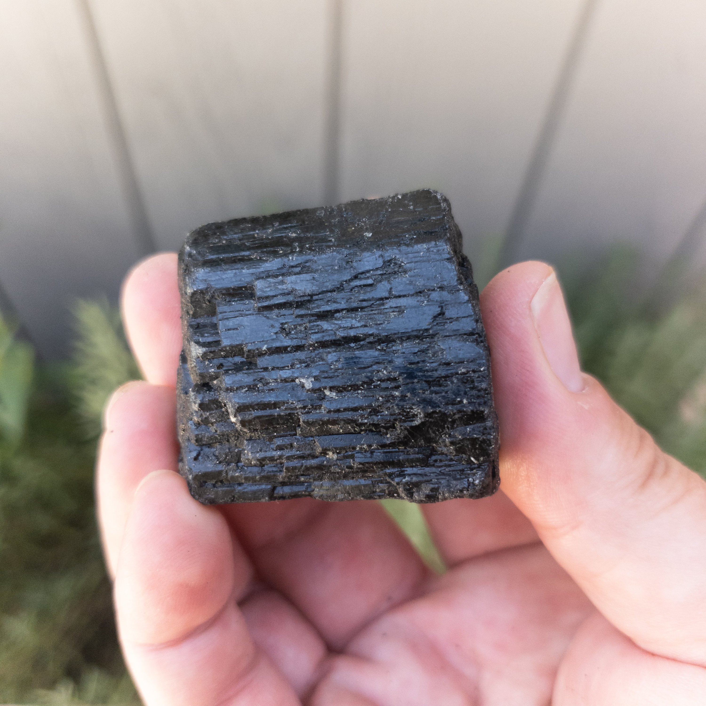 Medium chunks of rough black tourmaline, showcasing their natural texture and deep black color, ideal for energy clearing.