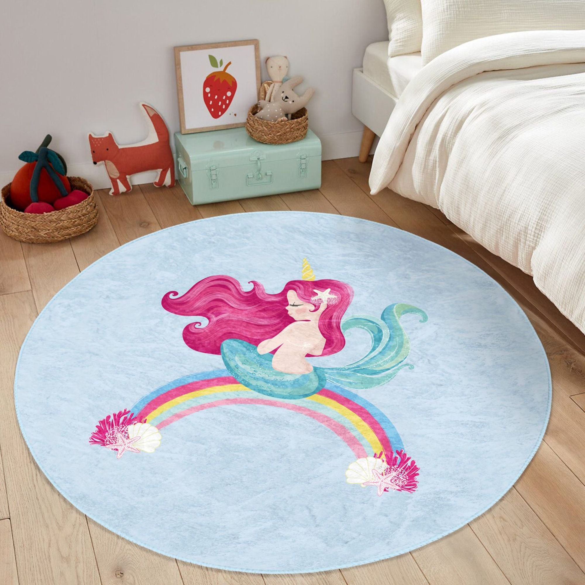 A vibrant blue kids rug featuring a whimsical mermaid design on a rainbow, perfect for children's rooms.