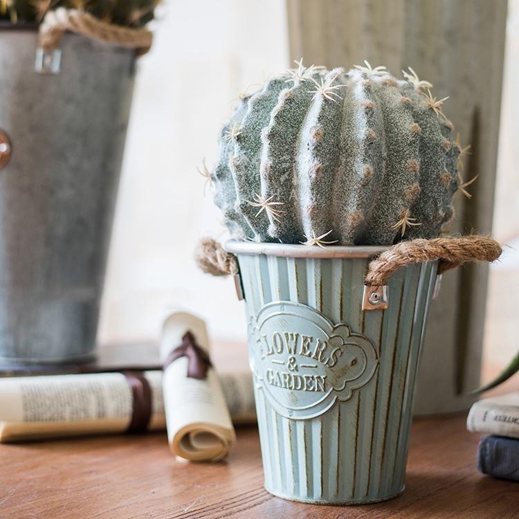 Set of three decorative metal pots with rope handles, featuring an antique paint finish in mixed green and gray colors.