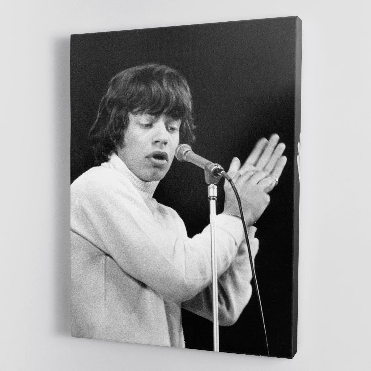 Mick Jagger performing on stage in 1965, captured in a vibrant canvas print or poster, showcasing the energy of rock music.